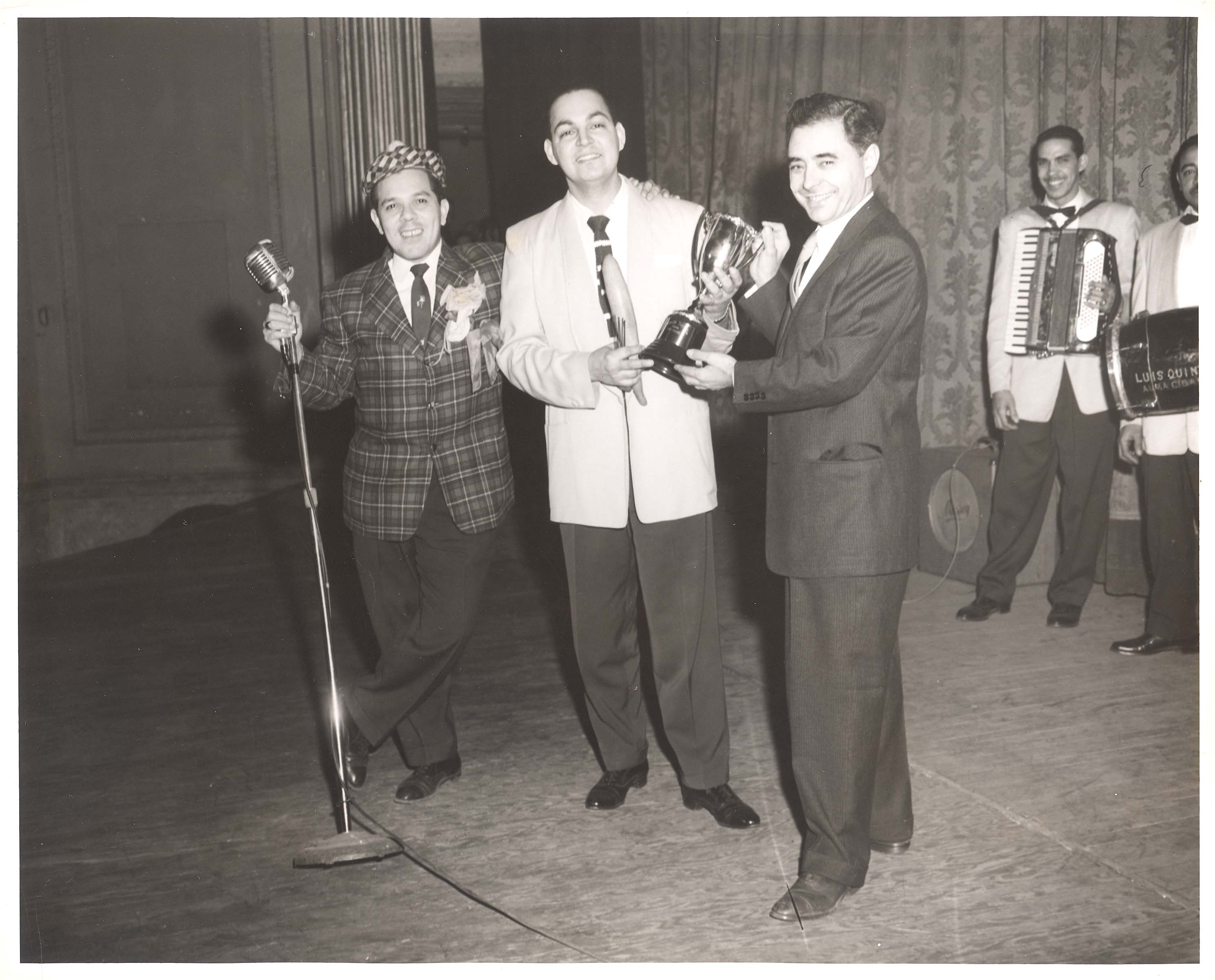 Dioris Valladares (center) receiving an award, ca. 1950s