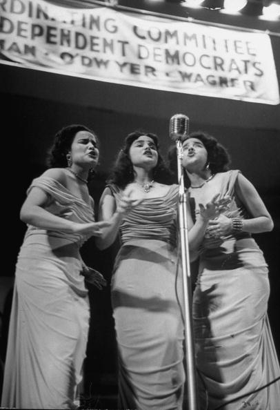 Dominican singing group Malagon Sisters perform at the Democratic Campaign to help capture Puerto Rican vote, October 1, 1949