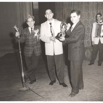 Dioris Valladares (center) receiving an award, ca. 1950s