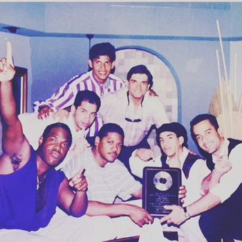 Proyecto Uno with Porfirio Piña, co-founder/manager, with Fediscos executives receiving gold record for "Esta Pegao" single, Ecuador, 1993
